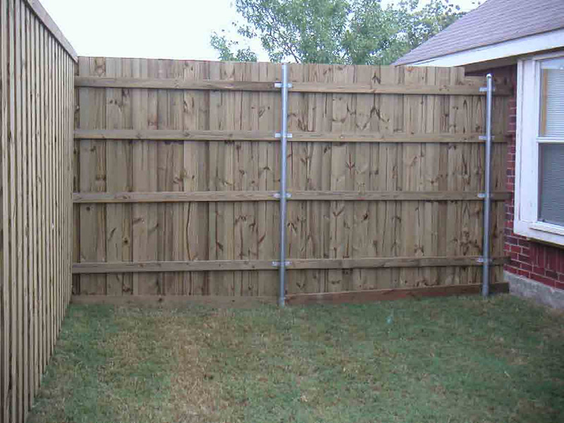 Wood Fence Installed with OZCO Wood to Steel Fence Brackets