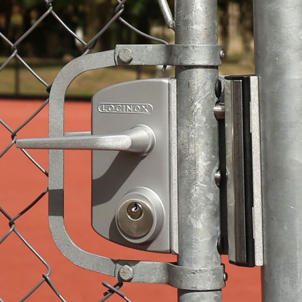 A lock and chain on Metal Fence that links of a gate. 7449605
