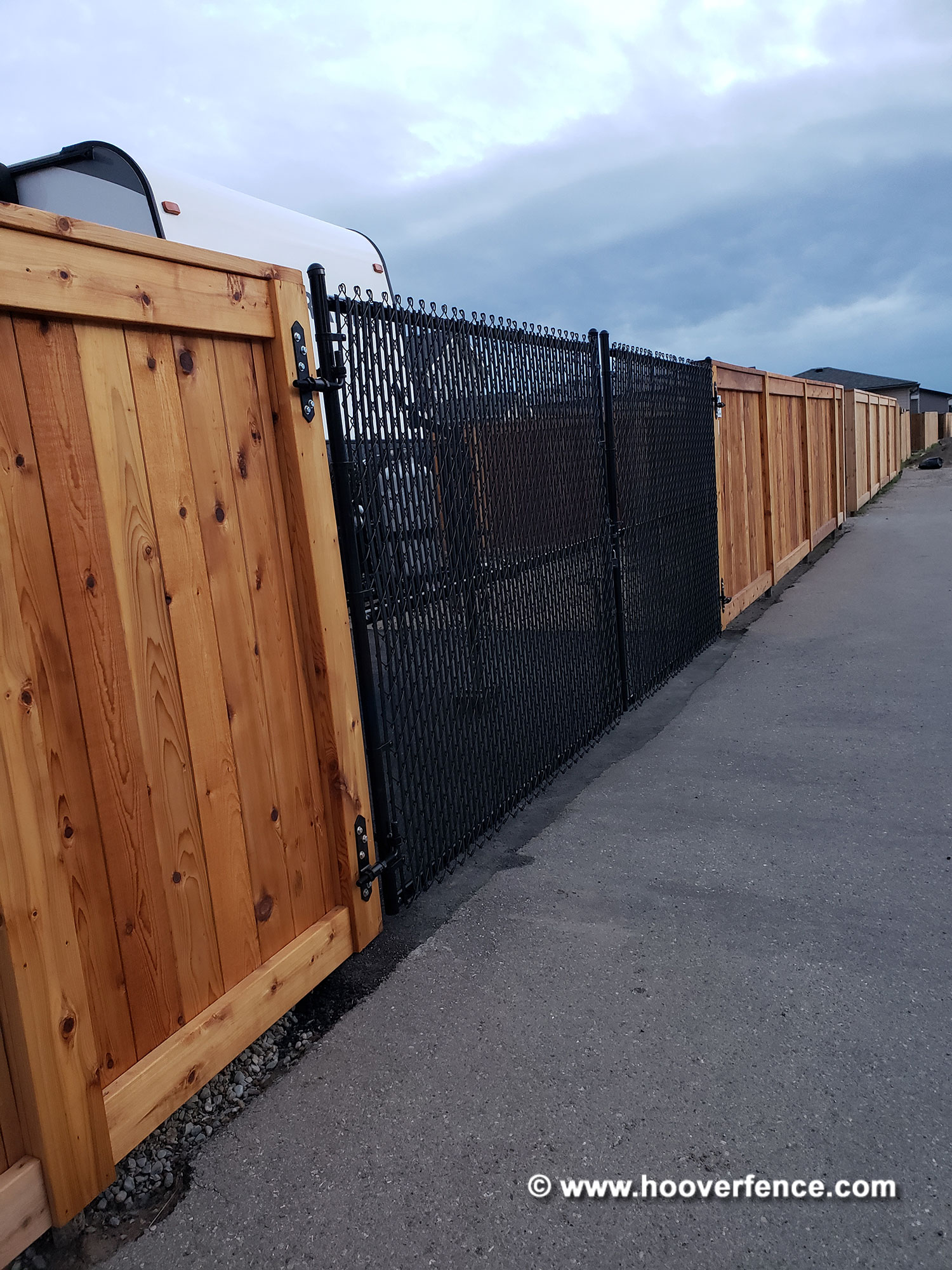 Customer Photo - Black Double Chain Link Gate Installed on Cedar Fence - Alberta, Canada