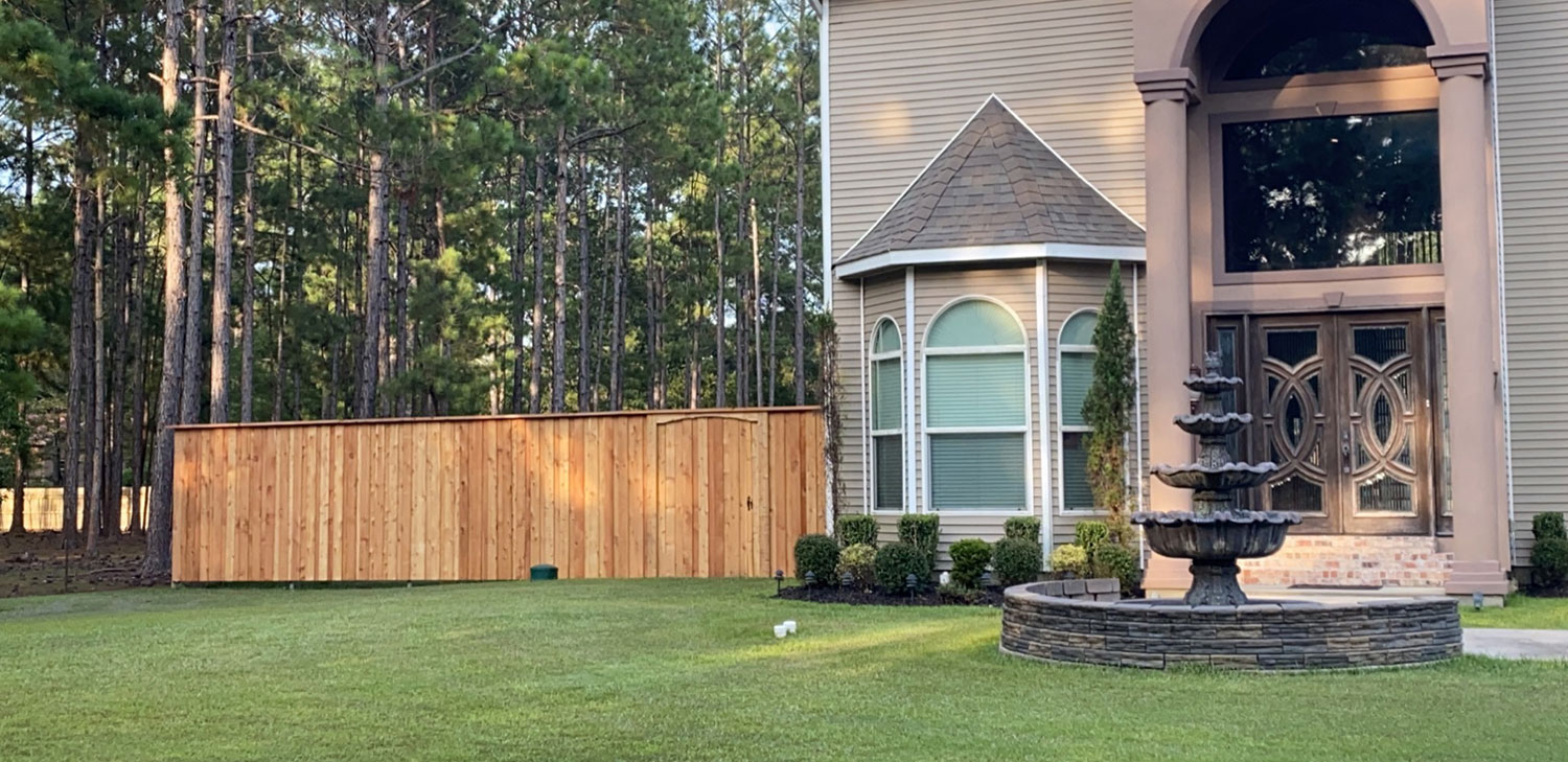 Customer Photo - Cedar Board and Batten Privacy Fence Built With Chain Link Fence Posts and Wood to Steel Fence Brackets - Abita Springs, LA