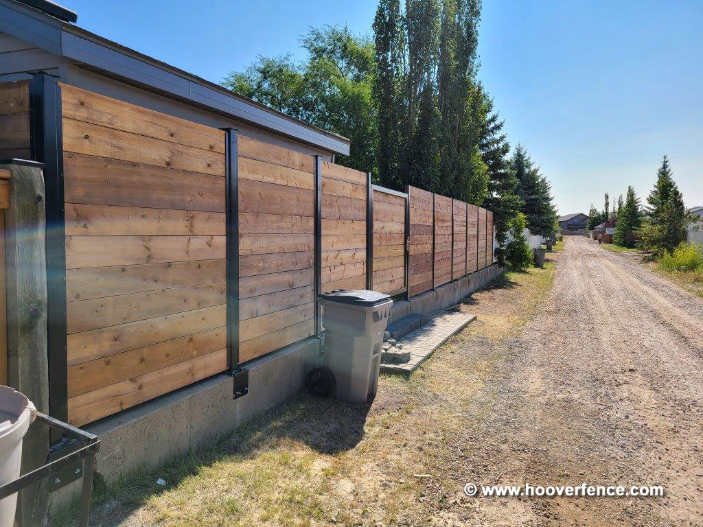 Customer Photo - Horizontal Redwood Privacy Fence with Black Steel Posts and Gate Frames - Secured with Locinox Fortylock - Alberta, Canada