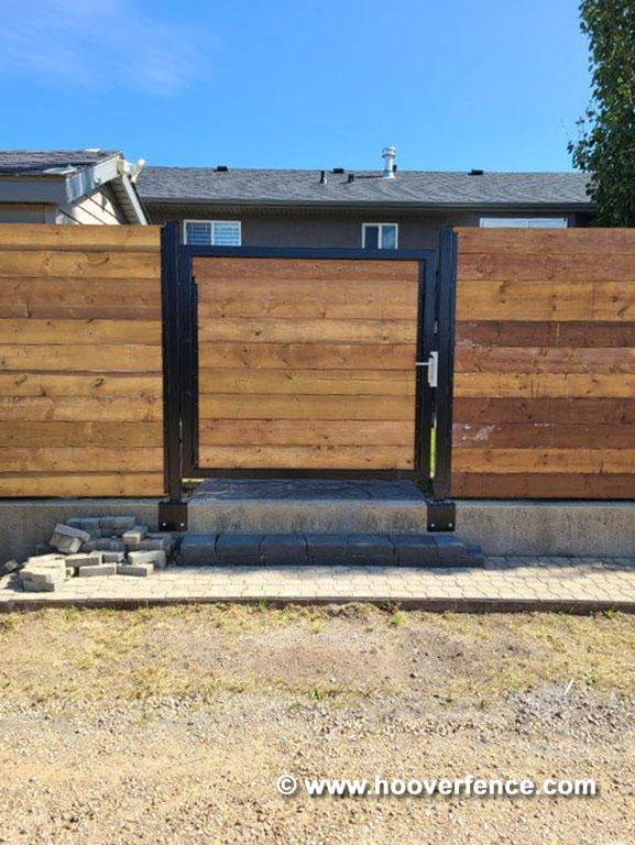 Customer Photo - Horizontal Redwood Privacy Fence with Black Steel Posts and Gate Frames - Secured with Locinox Fortylock - Alberta, Canada