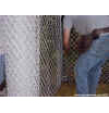 While connecting chain link, brace bands may be adjusted to correct height on fence post.