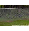 A neatly completed chain link fence adds security for owners and pets.